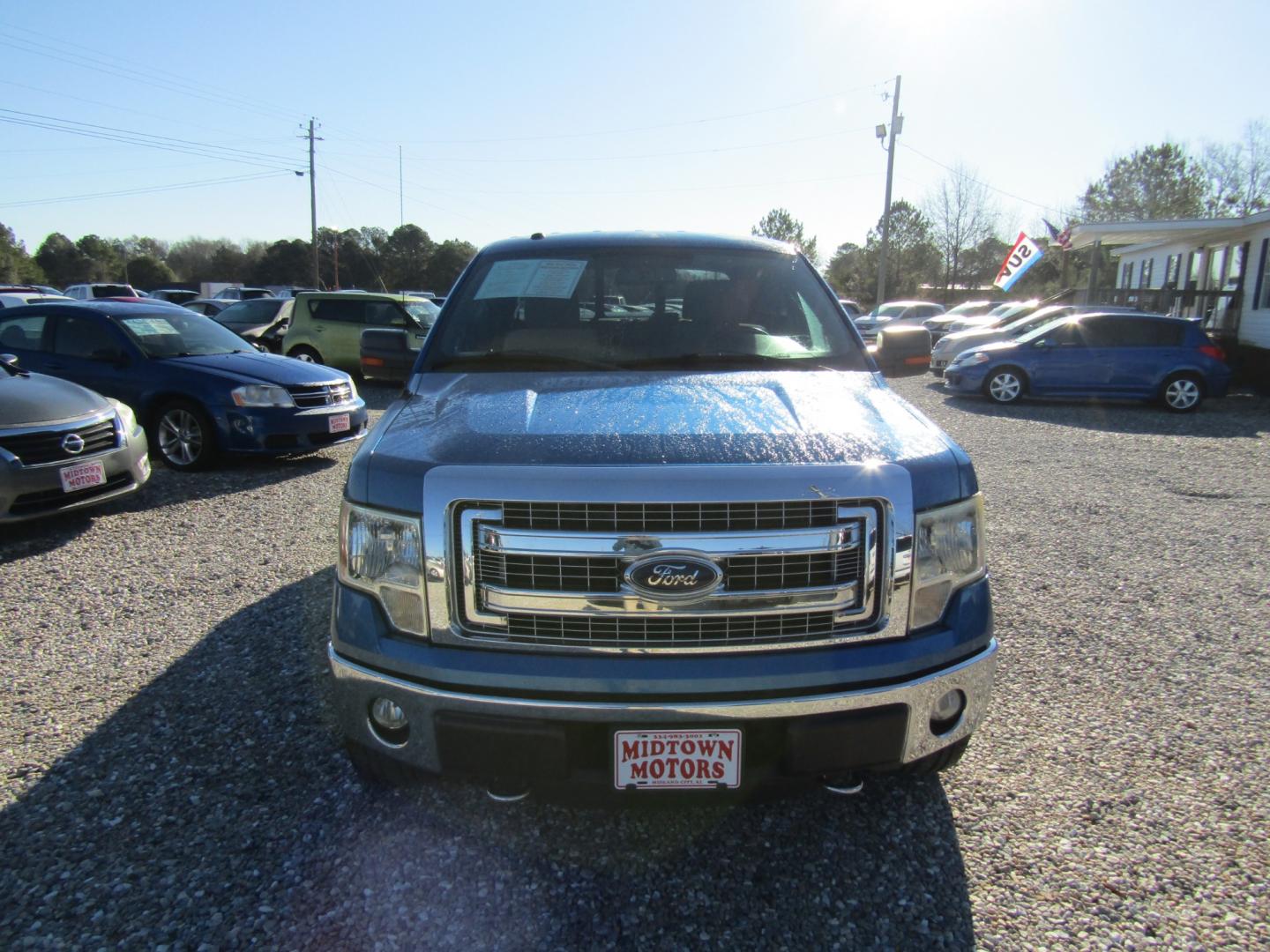 2013 Blue Ford F-150 XLT SuperCrew 6.5-ft. Bed 4WD (1FTFW1ET3DF) with an 3.5L V6 TURBO engine, Automatic transmission, located at 15016 S Hwy 231, Midland City, AL, 36350, (334) 983-3001, 31.306210, -85.495277 - Photo#1